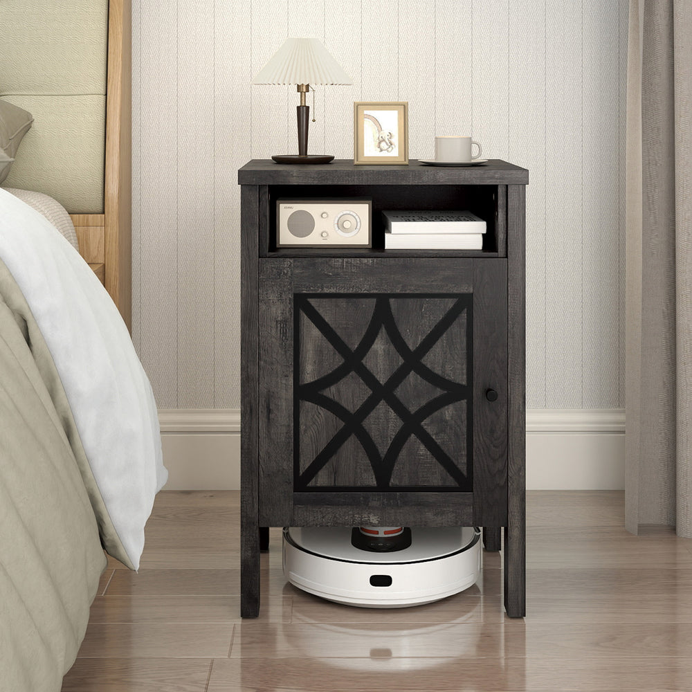 Gray robot vacuum storage cabinet with a decorative door design and open shelf, suitable for bedroom or living room use.
