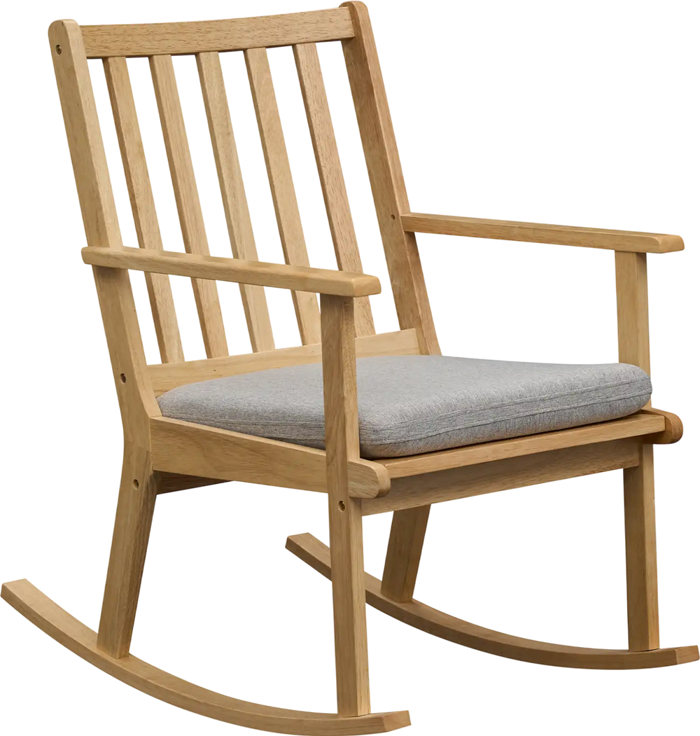 Natural solid rubber wood rocking chair with a padded seat cushion, perfect for relaxing and reading.