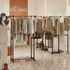 Double rod garment rack with curved rods to prevent wrinkles, featuring adjustable height and built-in safety locks for.