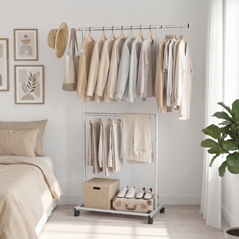 Double-rod rolling clothes rack with extendable top rod, adjustable height, and wheels for easy mobility in any room.