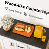 Rolling kitchen island cart with wood-like countertop, storage cabinets, and smooth-rolling casters for easy mobility.