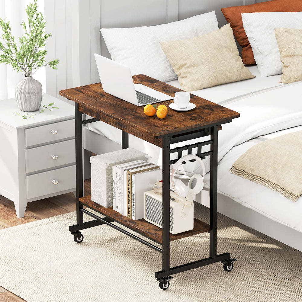Rolling laptop table in rustic brown with pull-out keyboard tray and hooks, ideal for home office use.