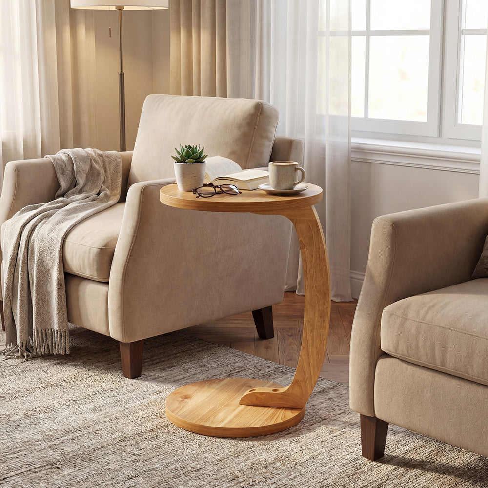 C-shaped side table made of solid teak wood with a thickened top, perfect for holding essentials next to your couch.
