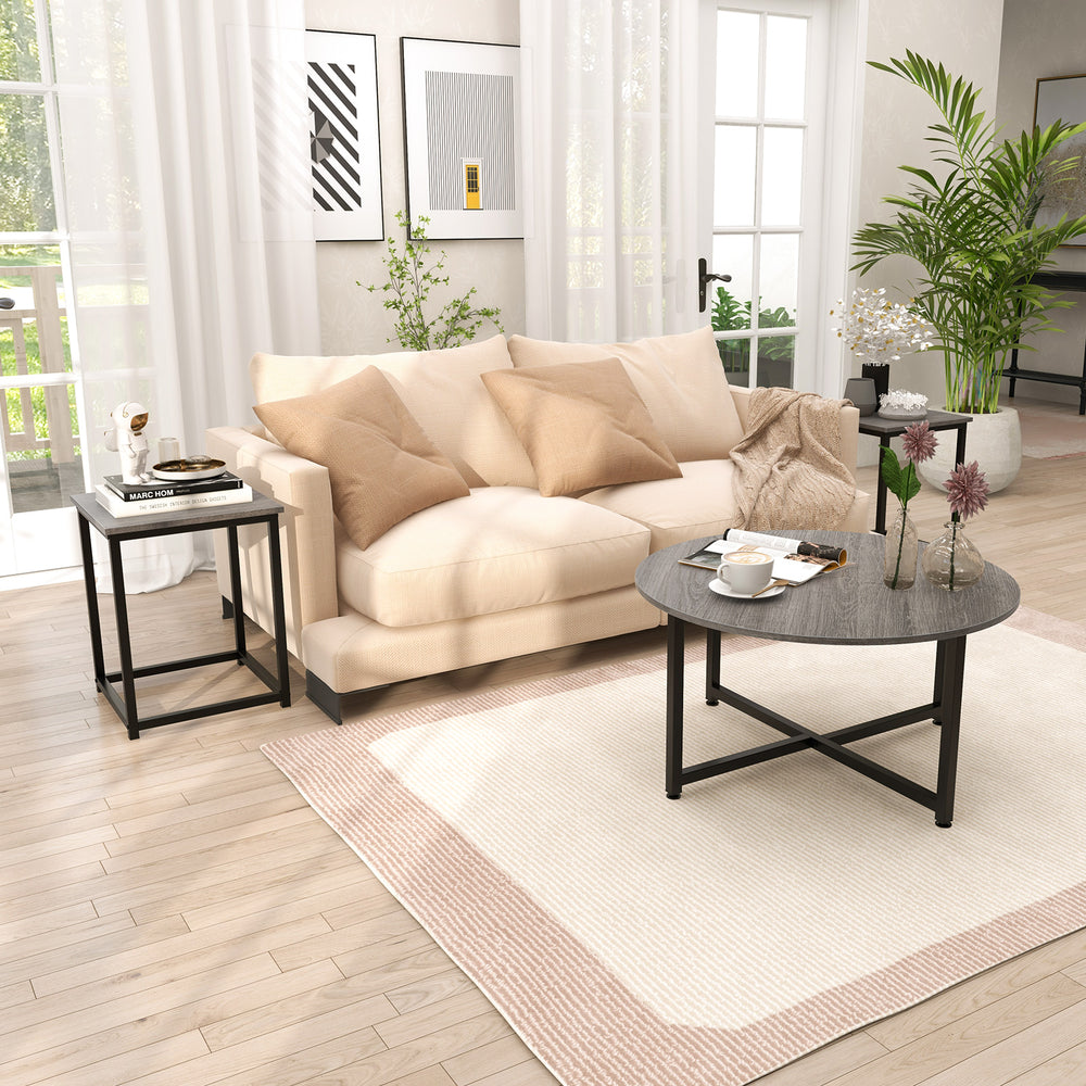 Gray round coffee table with two square end tables, featuring a textured surface and sturdy metal frame for versatile.