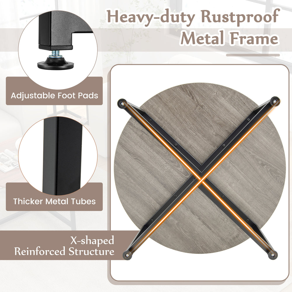 Round coffee table with X-shaped metal frame, gray finish, and adjustable foot pads for stability and style.