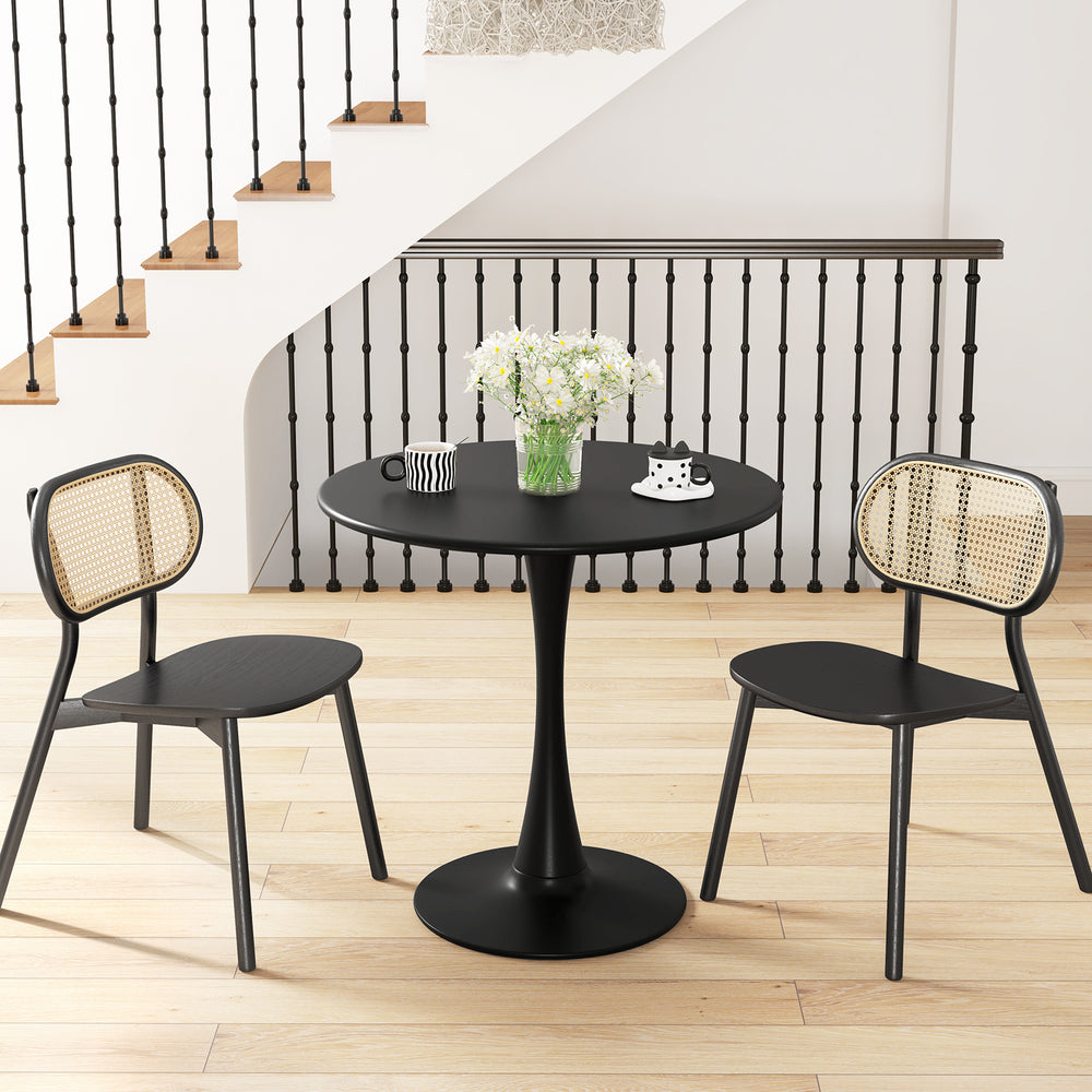 Round black dining table with a 31.5" surface, featuring an anti-slip PP ring, ideal for dining or casual gatherings.