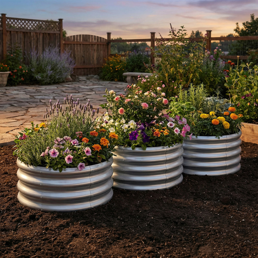 Round galvanized raised garden bed with colorful flowers, featuring durable steel panels and open-ended base for.