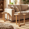 Round nesting coffee tables set of 2 in natural rubber wood, featuring spacious tabletops and a stable tripod frame.