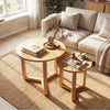 Round nesting coffee table set of 2 in natural wood, featuring spacious tabletops and stable tripod frames for.