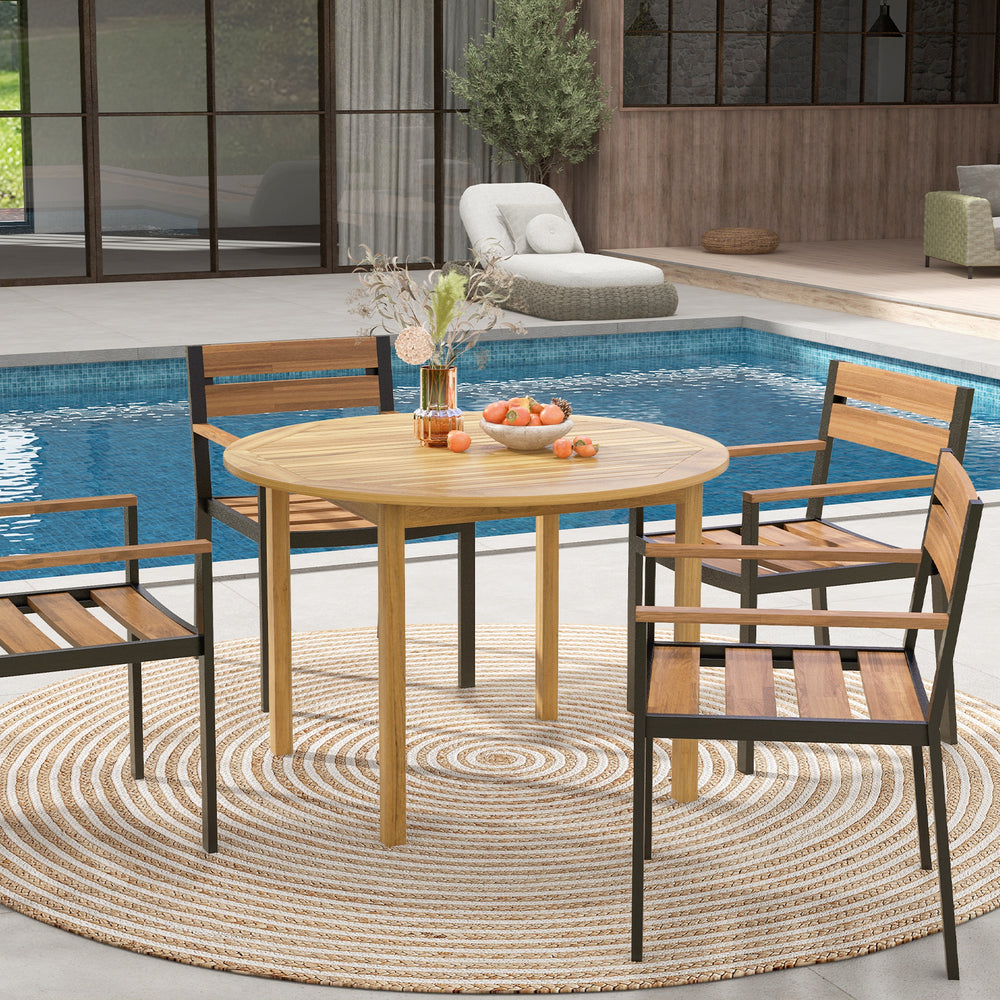 Round outdoor dining table made of acacia wood, seating 4, perfect for poolside gatherings or garden parties.