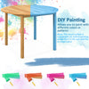 Large round outdoor dining table made of acacia wood, featuring a paintable surface for customizable designs.