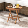 Round folding coffee table made of teak wood, featuring a slatted tabletop, ideal for outdoor picnics and camping.