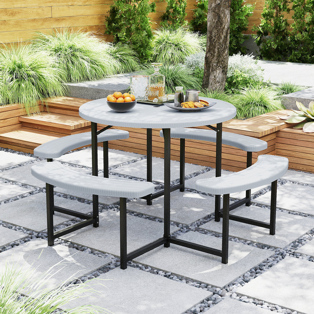Round picnic table set with four benches, waterproof HDPE top, and umbrella hole for outdoor patio use.