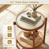 Round side table with 0.2" thick tempered glass top and PE rattan shelf, perfect for living room or bedroom.