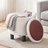 Round beige storage ottoman with removable lid, upholstered in linen fabric, ideal for blankets and books.