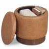 Round storage ottoman in brown faux leather with acacia wood frame, featuring hidden storage and 360° swivel.