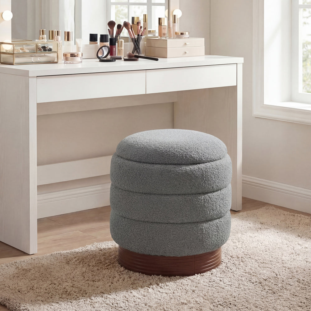 Gray round storage ottoman with acacia wood frame, showcasing a plush boucle fabric top for comfortable seating and.