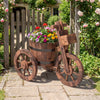 Rustic wood tricycle planter with wheels, featuring a barrel-shaped design and storage box, perfect for outdoor flower.