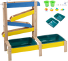 Montessori sand and water table with fir wood frame, two basins, plant pots, and toys for outdoor sensory play.