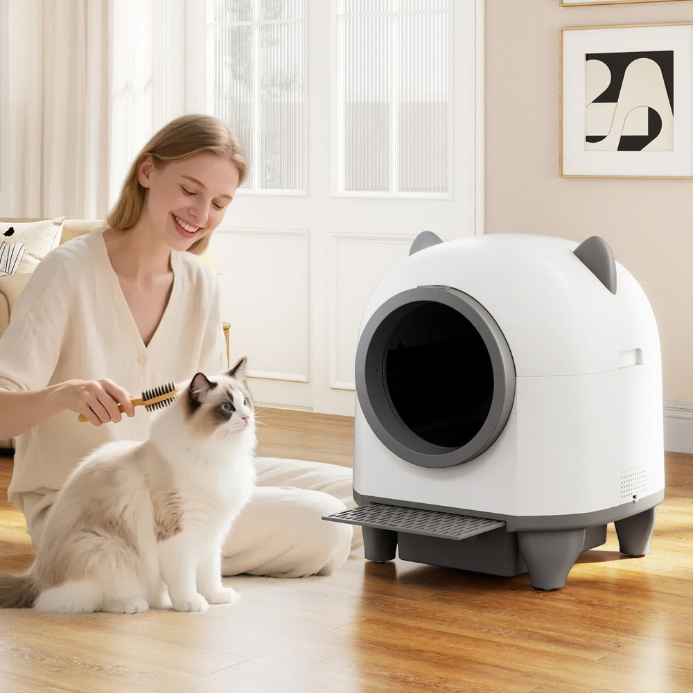 Self-cleaning litter box for multi-cat homes, featuring a quiet operation and large waste bin, ideal for hassle-free.