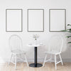 Vintage Windsor wood dining chairs in white with spindle back, offering ergonomic support and elegant style for dining.