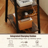 Industrial side table in rustic brown with integrated charging station, 3-tier shelves, and robust metal frame for stability.