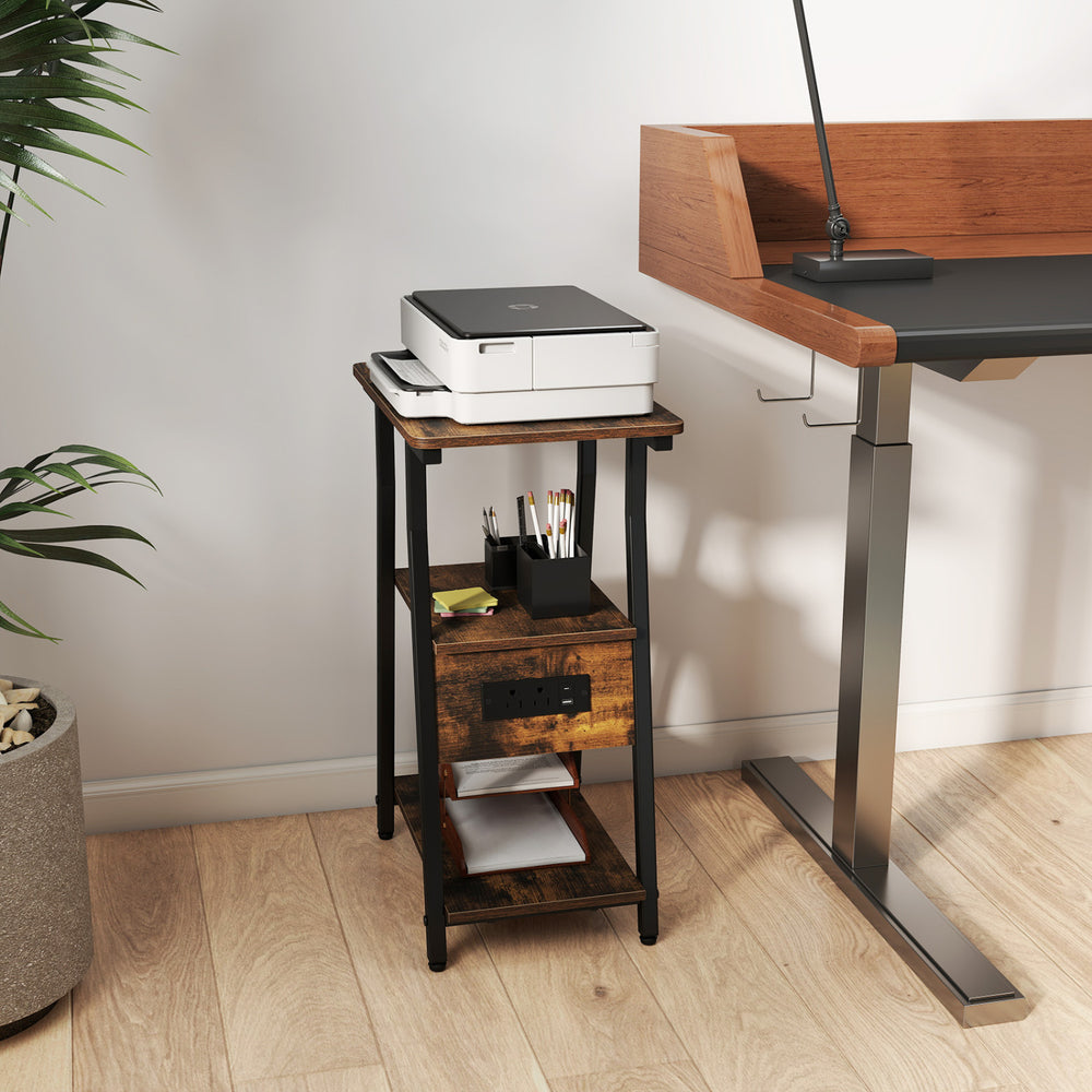 Industrial side table in rustic brown with 3-tier shelves and integrated charging station, perfect for small spaces.