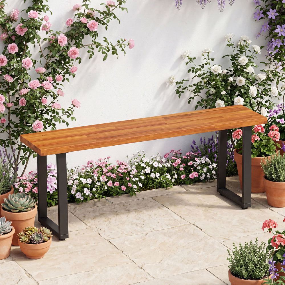 Acacia wood patio bench with U-shaped metal legs, suitable for dining or garden use, measuring 47.5" long.