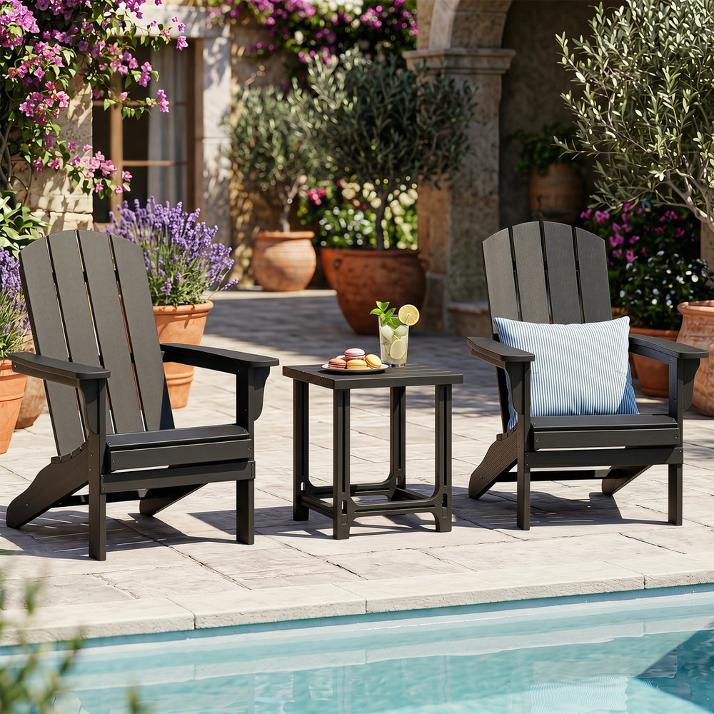 Two black outdoor Adirondack chairs with a slatted side table, perfect for poolside relaxation and low-maintenance use.