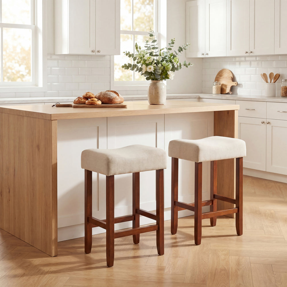 Set of 2 backless bar stools with cushioned seats in off-white, featuring rubber wood legs for kitchen or dining use.