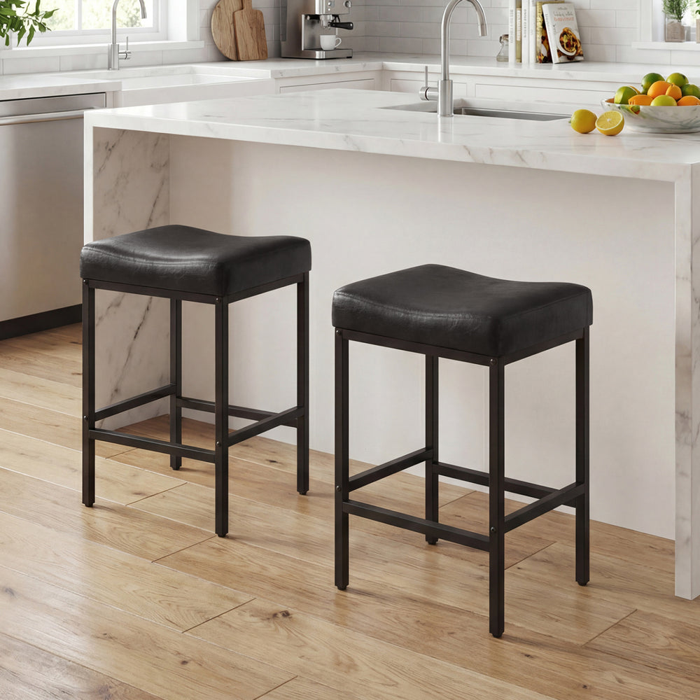 Set of 2 black counter height bar chairs with ergonomic saddle seats, ideal for kitchen islands and easy cleaning.