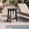 Black eucalyptus wood side table with slatted tabletop and storage shelf, perfect for outdoor patio or poolside use.