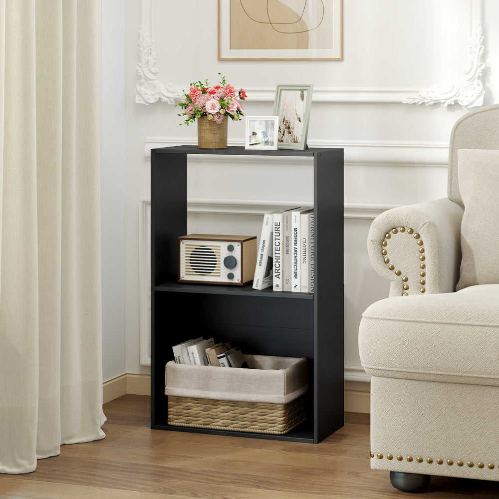 Black 3-tier bookshelf with open storage compartment, ideal for organizing books and decor in any room.