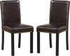 Set of 2 faux leather upholstered dining chairs with nailhead accents, solid wood legs, ideal for kitchen or dining.