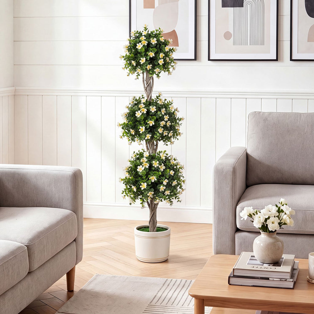 Artificial topiary tree with three balls and white blossoms, perfect for home decor and maintenance-free greenery.