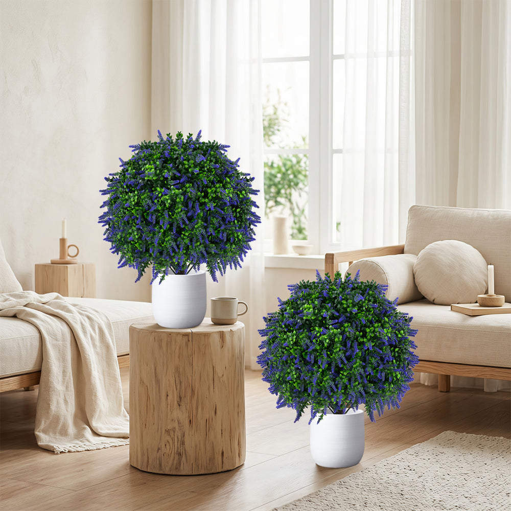 Set of 2 artificial lavender topiary ball trees in white pots, adding vibrant color and elegance to any living space.