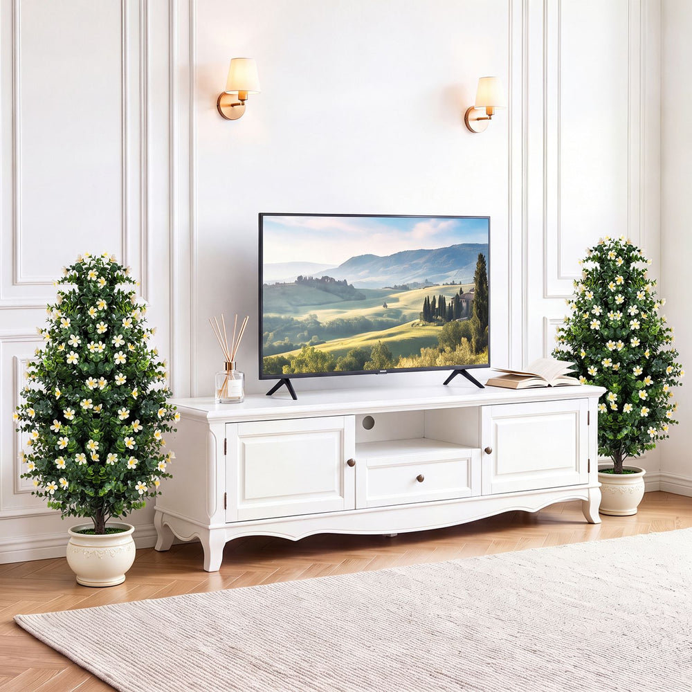 Set of 2 artificial topiary trees with white blossoms in weighted pots, perfect for enhancing any living space decor.
