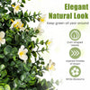 Set of 2 artificial topiary trees with white blossoms and coin-shaped leaves, ideal for versatile home and office decor.