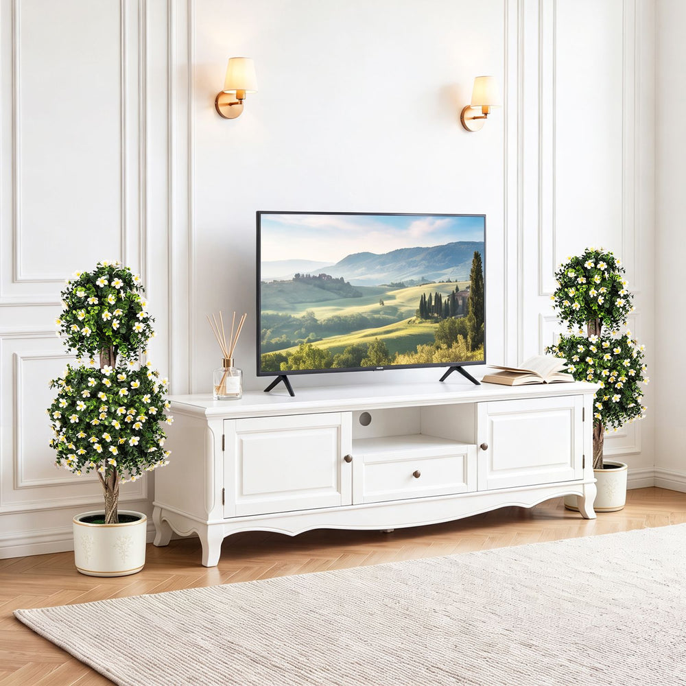 Two artificial topiary trees with white blossoms in weighted pots, perfect for enhancing living spaces or events.