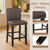 Brown bar stool with backrest and nailhead trim, featuring a comfortable padded seat and protective foot pads for stability.