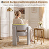 Comfy gray velvet barrel accent chair with curved backrest and integrated armrests for enhanced sitting comfort.