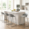 Counter height bar stools with curved backrest and metal frame, offering comfort and stability for kitchen seating.