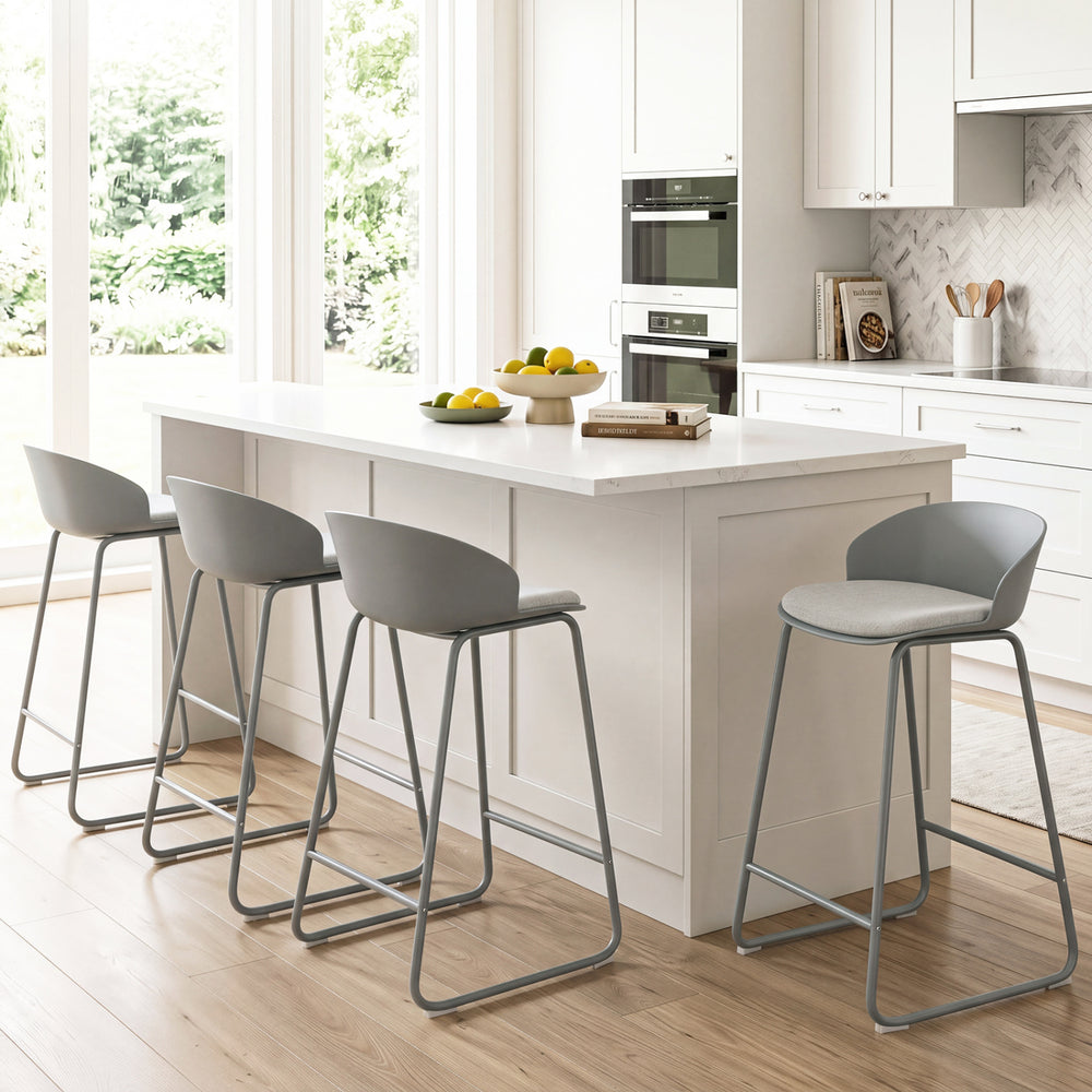 Counter height bar stools with curved backrest and metal frame, offering comfort and stability for kitchen seating.