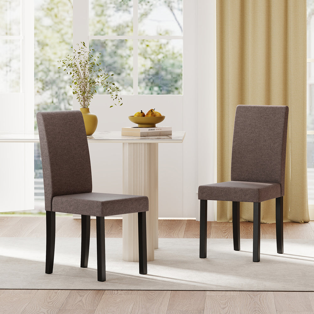 Set of 2 mid-century modern dining chairs in brown fabric upholstery with rubber wood frames, ideal for dining areas.