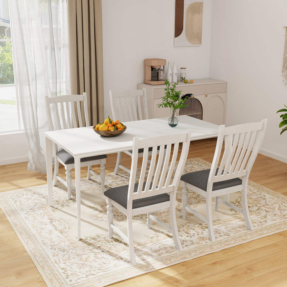 Set of two white dining chairs with solid wood legs and thick cushions, ideal for comfort in dining areas.