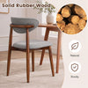 Curved back dining chair in gray fabric with solid rubber wood frame, perfect for dining rooms and kitchens.