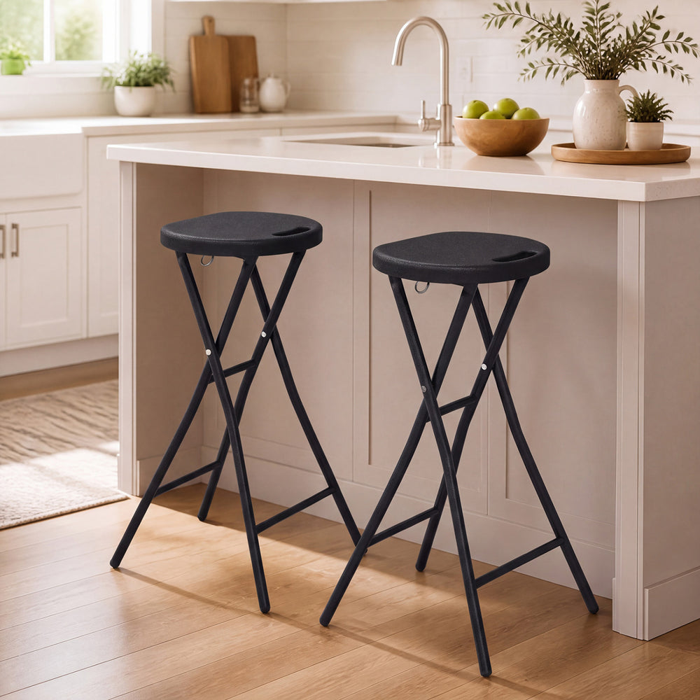 Two black folding bar stools with HDPE seats and carry handles, perfect for kitchen islands or home bars.
