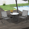 Two gray folding rocking chairs with breathable fabric and a small table, perfect for outdoor relaxation by the pool.