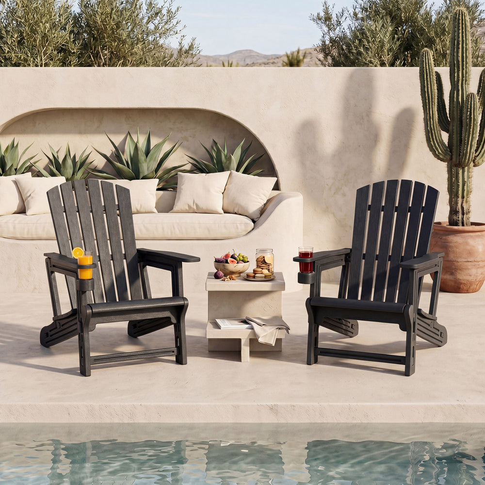 Set of 2 black HDPE Adirondack chairs with cup holders and wood-like texture, perfect for outdoor relaxation by the poolside.