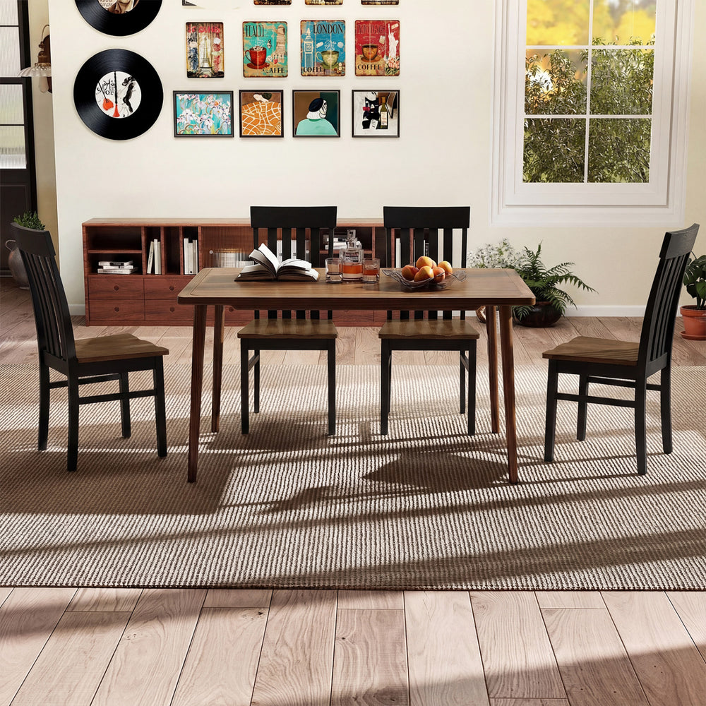 Black kitchen armless dining chairs with slatted high backrests, perfect for modern dining spaces.